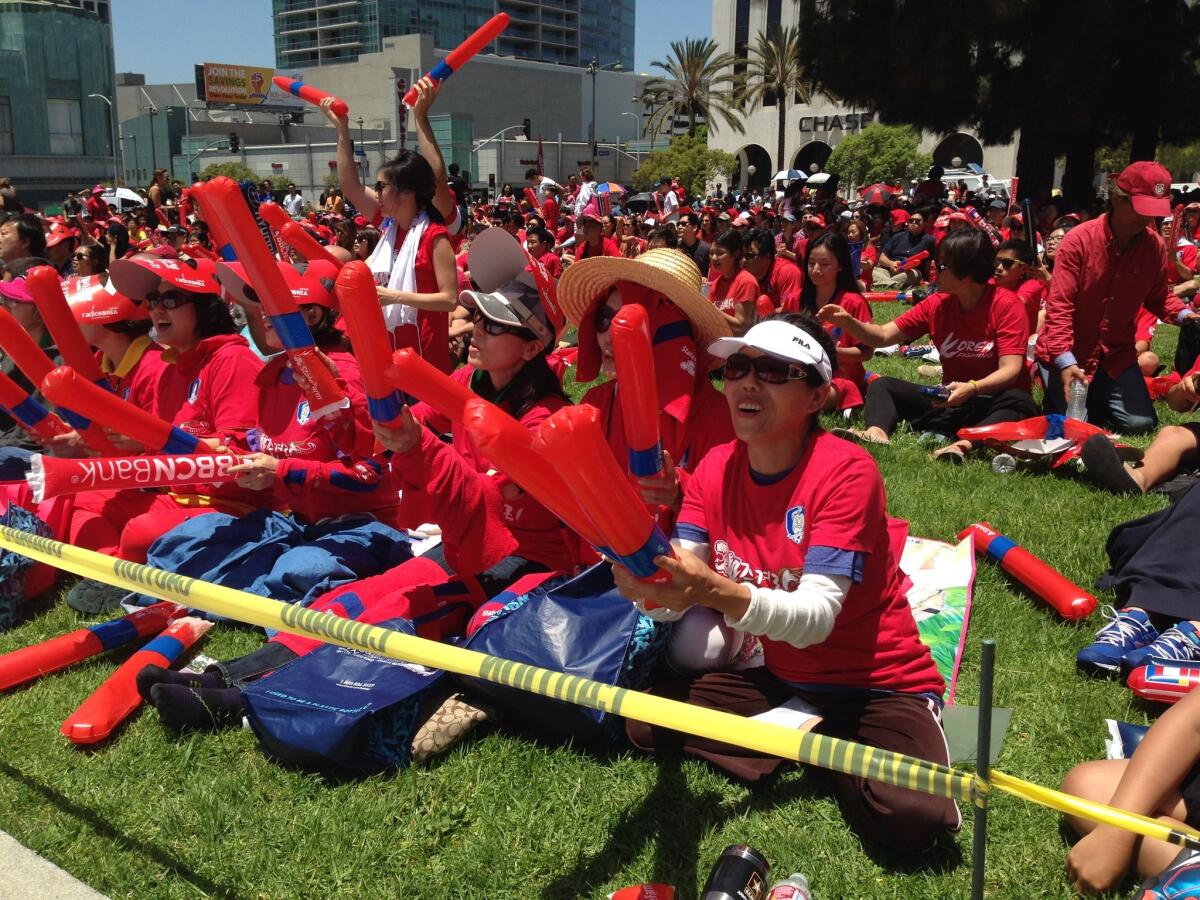 Hundreds of fans gather in Koreatown on Sunday to watch Algeria take on South Korea at the World Cup.