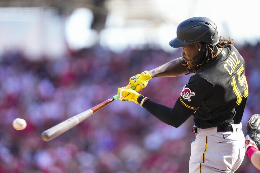 Pittsburgh Pirates' Oneil Cruz (15) hits a solo home run against the Cincinnati Reds in the second inning of an opening day baseball game in Cincinnati, Thursday, March 30, 2023. (AP Photo/Jeff Dean)