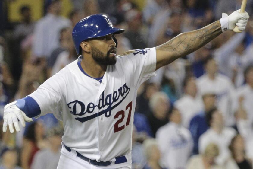 Dodgers outfielder Matt Kemp hits a two-run home run in the seventh inning of a July 29 game against the Atlanta Braves.