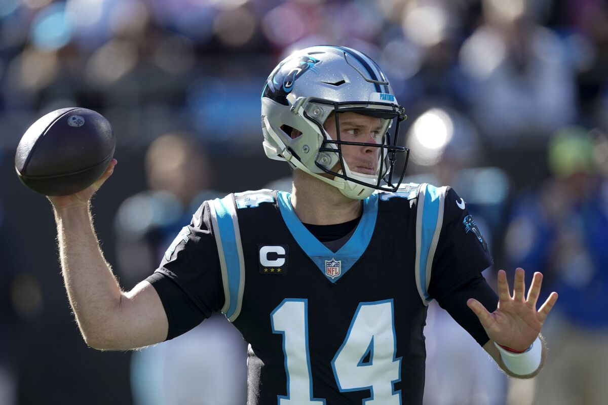 Carolina Panthers quarterback Sam Darnold passes against the New England Patriots during the first half of an NFL football game Sunday, Nov. 7, 2021, in Charlotte, N.C. (AP Photo/John Bazemore)