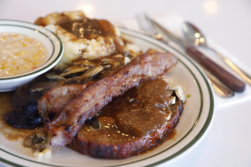 The meatloaf from Norms, served with bacon, mashed potatoes and mushrooms.