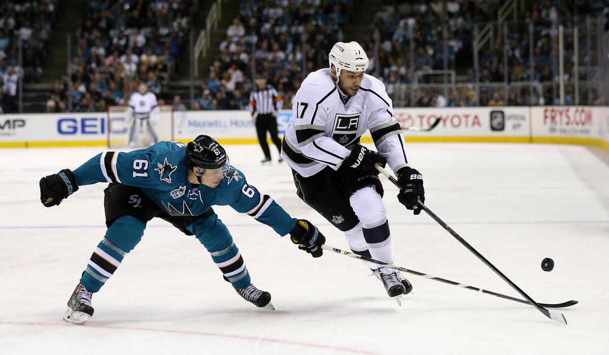 The Kings' Milan Lucic, right, and the Justin Braun go for the puck in Game 4 of the Western Conference first-round series on April 20.