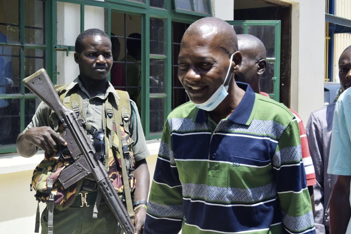 Kenya's cult leader Paul Nthenge Mackenzie arrives at court  under tight security, in Mombasa, Kenya.