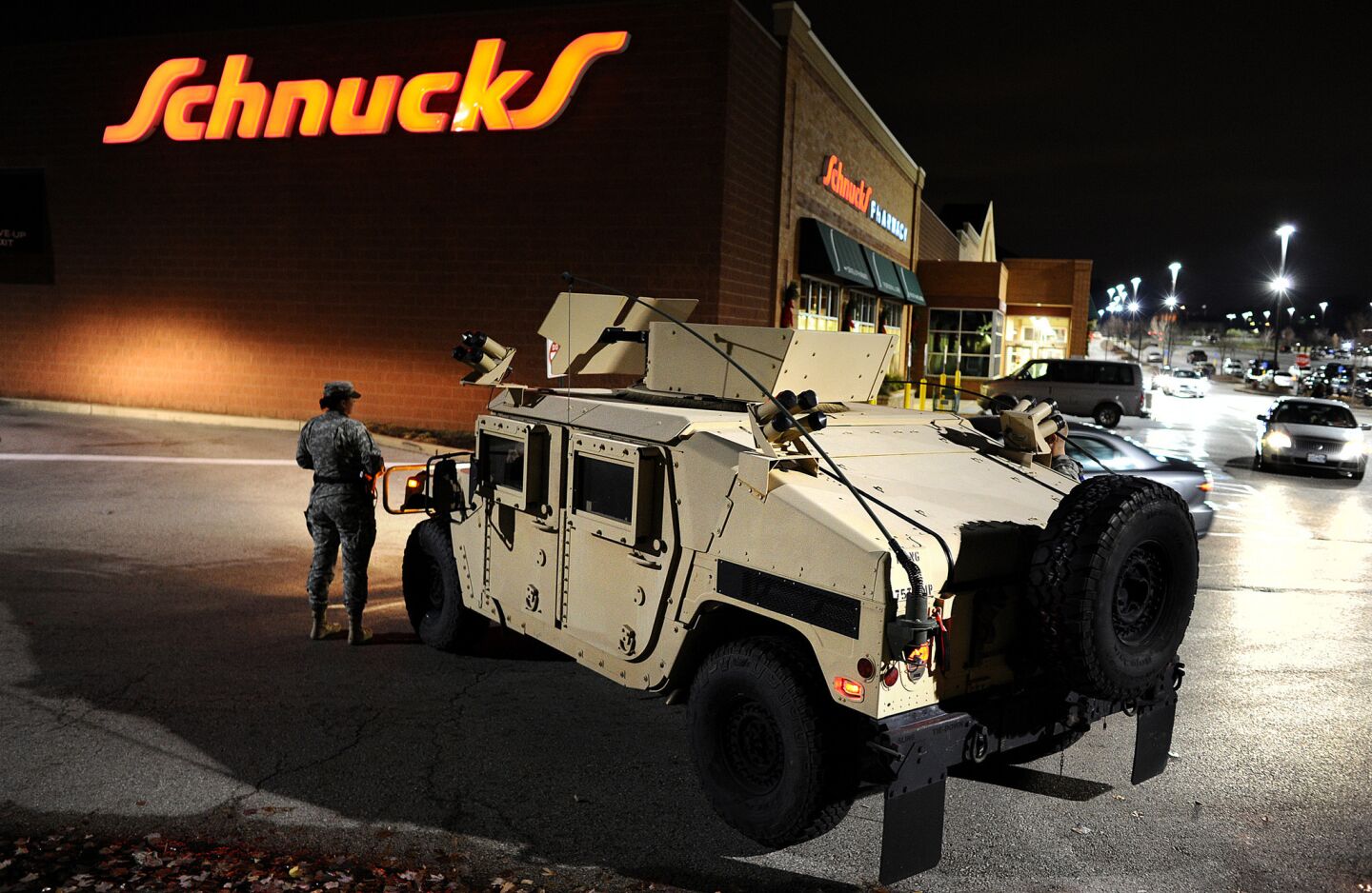 National Guardsmen take up positions in a shopping center in Ferguson, Mo., on Nov. 24 before the announcement that a grand jury had declined to charge police Officer Darren Wilson in the killing of Michael Brown.
