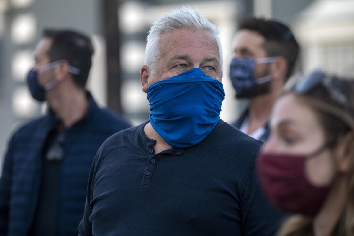 A man in a blue mask