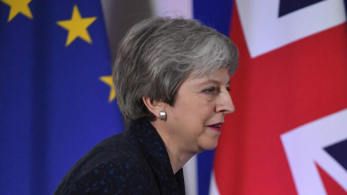 British Prime Minister Theresa May arrives at a news conference Friday in Brussels.