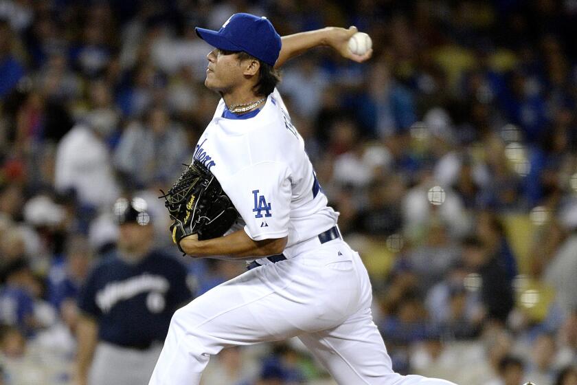 Dodgers reliever Chin-Hui Tsao delivers a pitch against the Rockies in the seventh inning on July 10, 2015.