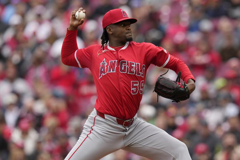 Los Angeles Angels starting pitcher José Soriano throws in the first inning of a baseball game.