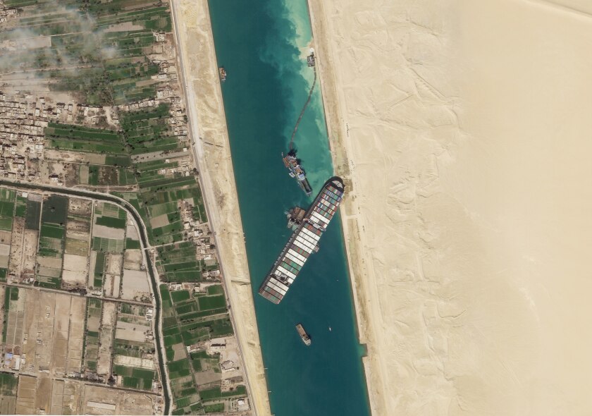 An aerial view of the cargo ship wedged diagonally in the Suez Canal