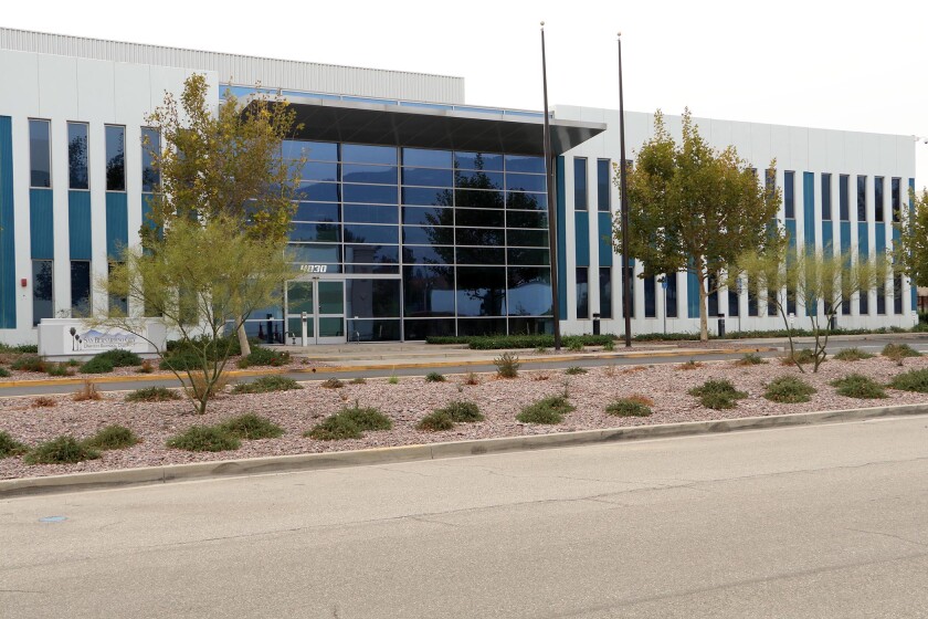 A view of the glass and concrete exterior of the San Bernardino City Unified School District headquarters.