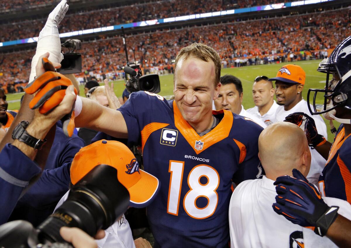 Denver Broncos quarterback Peyton Manning celebrates his 509th career touchdown pass with teammates during the first half against the San Francisco 49ers on Oct. 19.