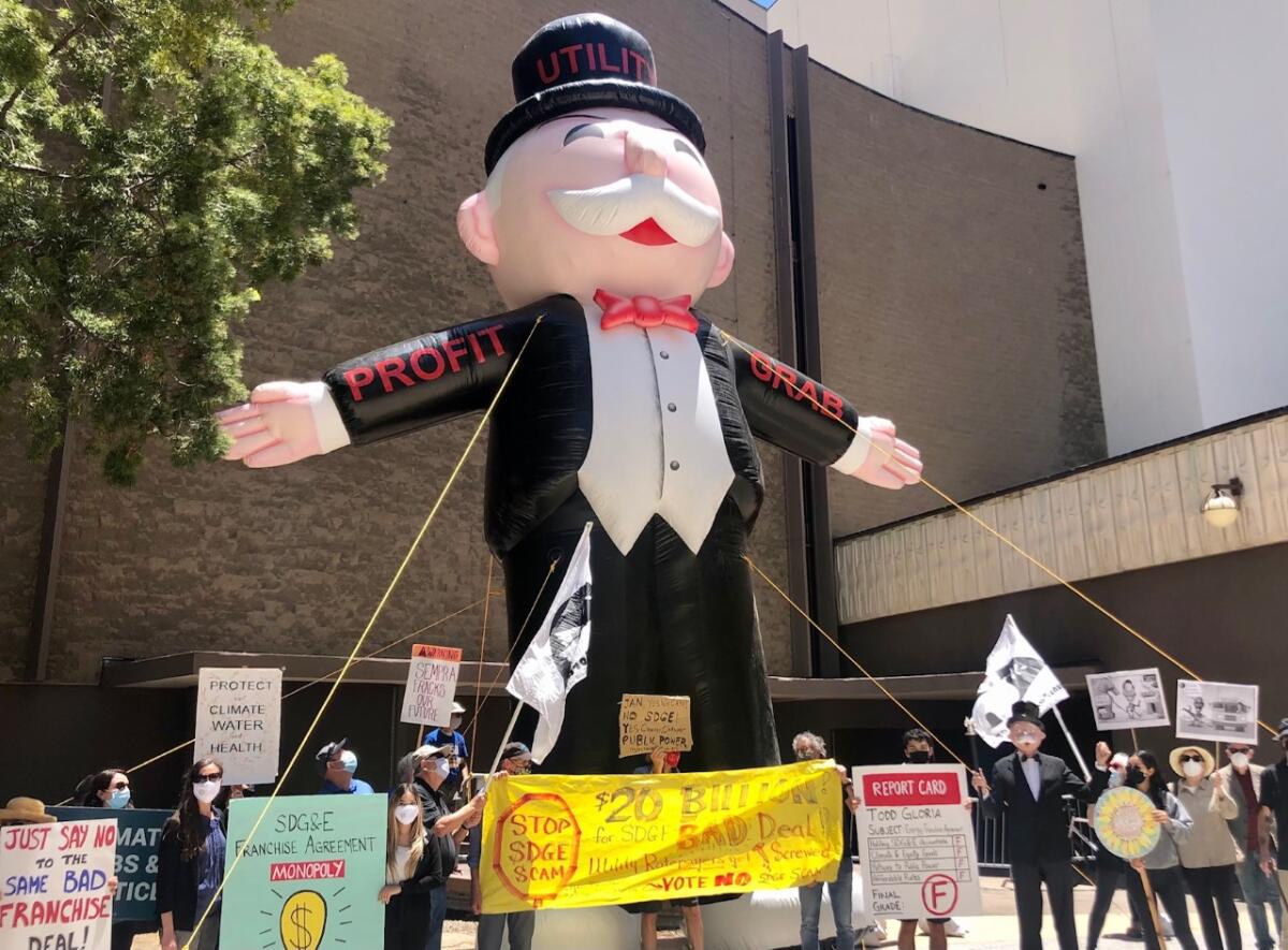 Demonstrators protest in San Diego against a franchise deal between the city of San Diego and SDG&E in 2021.