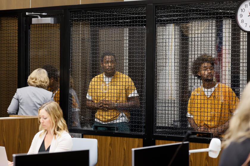 Malachi Darnell, Leroy McCrary and Jaden Cunningham wait during their court arraignment 