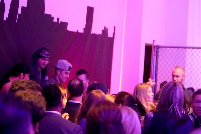 He made it into this one: Justin Bieber, in the ball cap, attends Maxim's Big Game Weekend party at Espace on Friday in New York City.