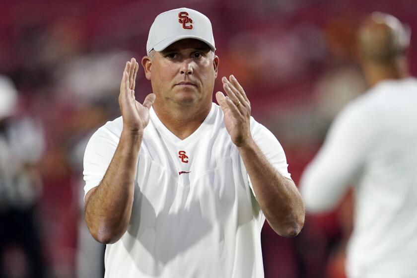 Southern California head coach Clay Helton watches warm ups on the field before an NCAA college football game against Stanford Saturday, Sept. 11, 2021, in Los Angeles. (AP Photo/Marcio Jose Sanchez)