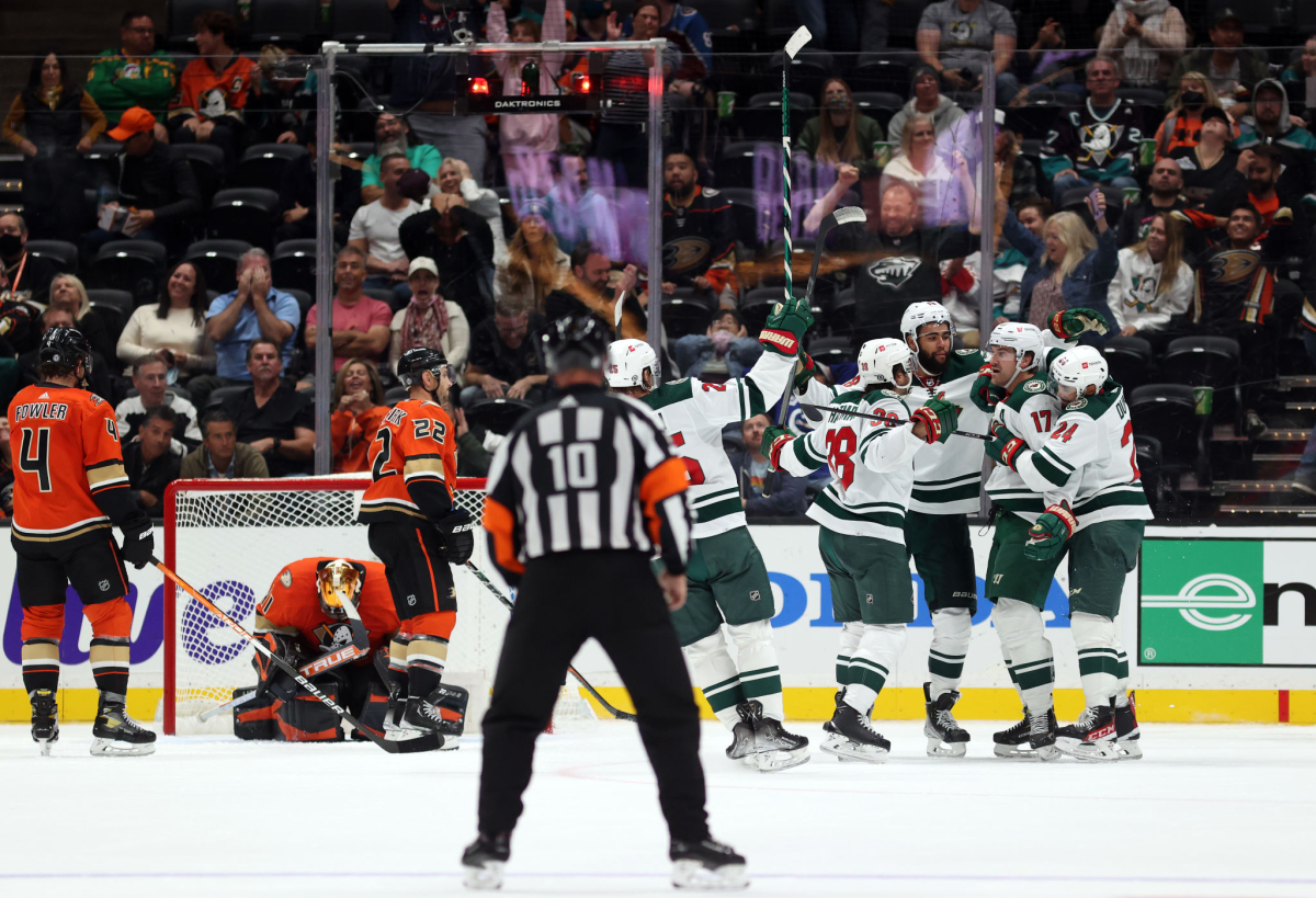 The Wild's Marcus Foligno (17), right, celebrates his goal with 7.2 seconds left in a win against the Ducks on Oct. 15, 2021.