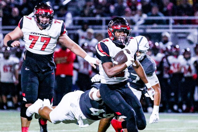 Cornell Hatcher of Corona Centennial ran for five touchdowns in 43-42 loss to St. John Bosco.