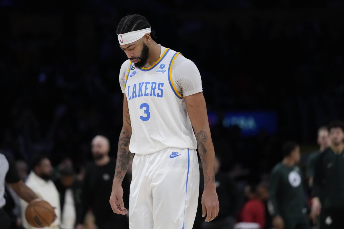 Los Angeles Lakers' Anthony Davis leaves the court after the team's 122-118 overtime loss to the Boston Celtics 