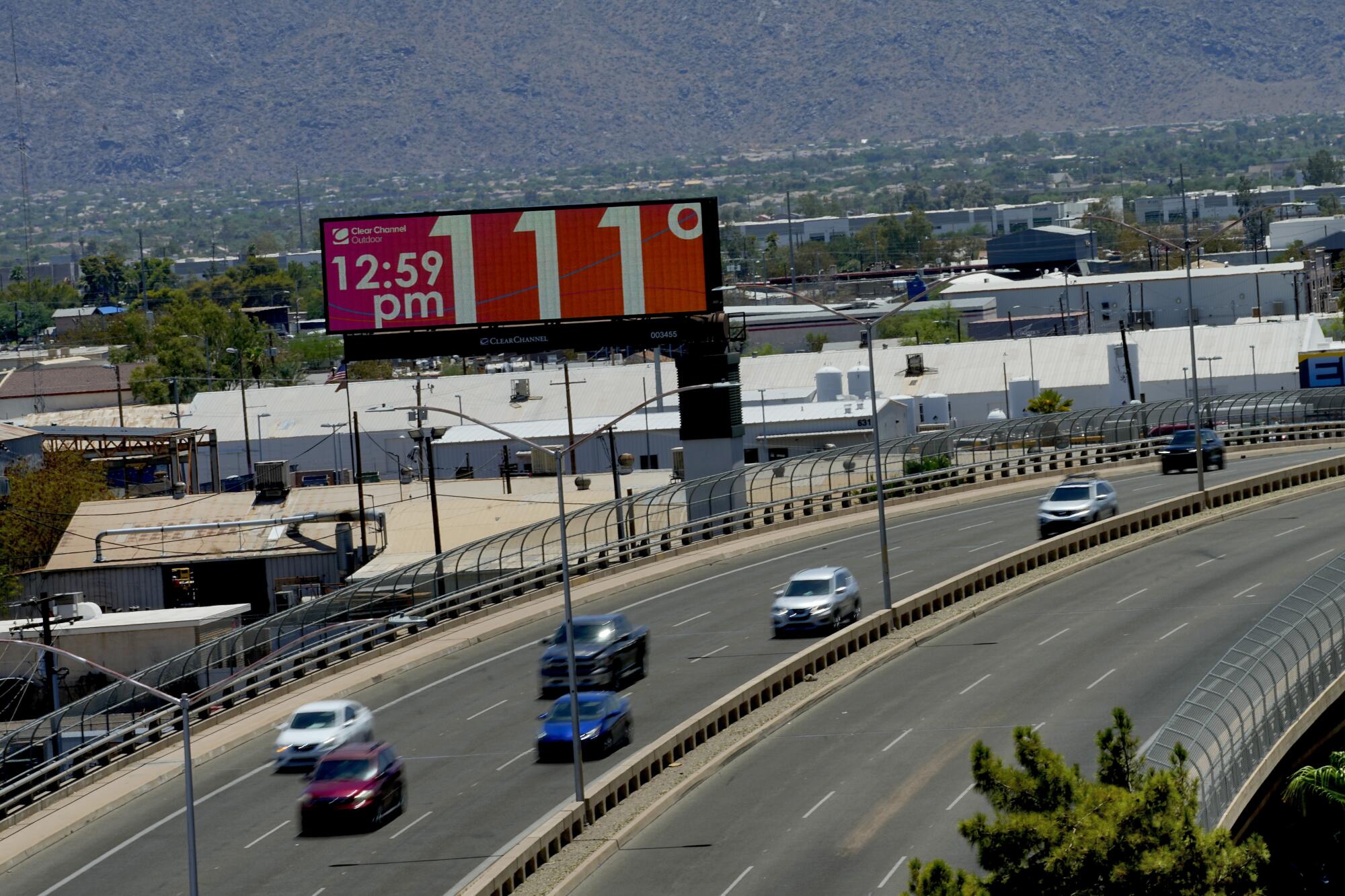 A digital billboard reads 111 degrees Fahrenheit