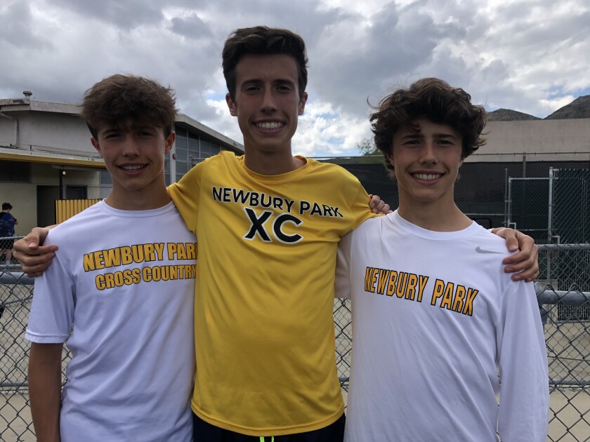 Nico Young poses for a photo with twin brothers Lex (left) and Leo. 