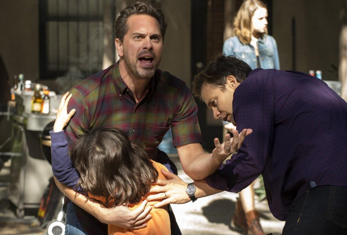 Dylan Schombing, Thomas Sadoski, background left, and Peter Sarsgaard, right, appear in a scene from "The Slap."