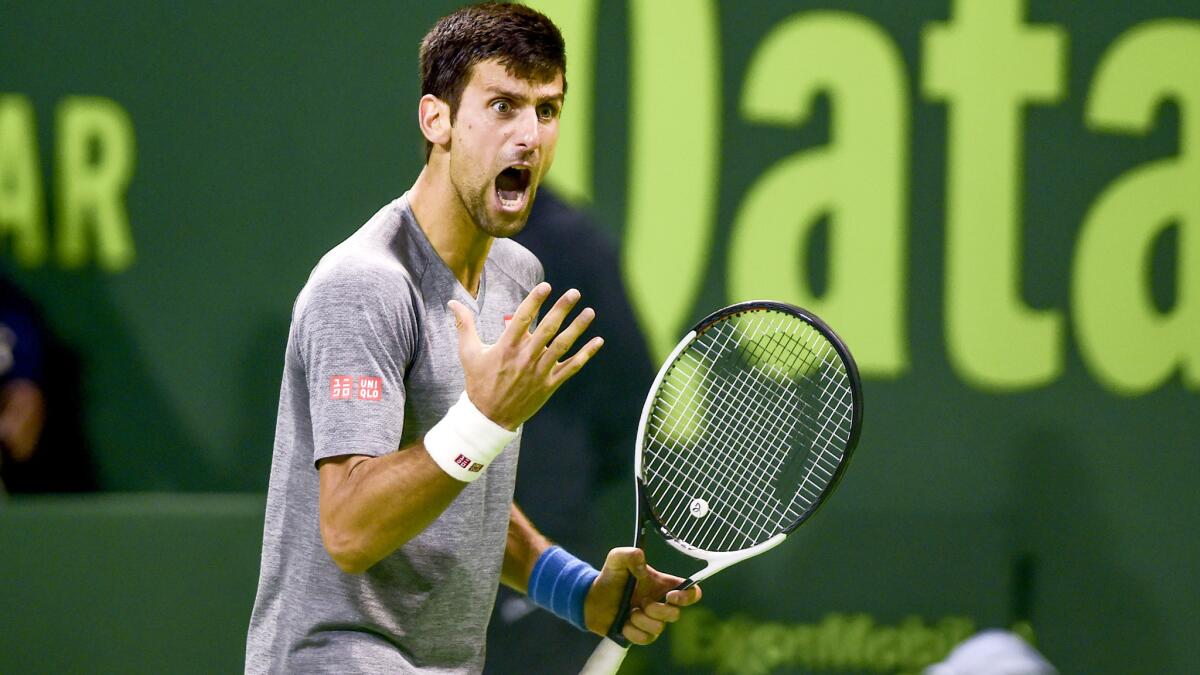 Novak Djokovic reacts after winning a point against Andy Murray during the championship match of the Qatar Open on Saturday.