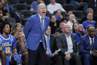 UCLA coach Mick Cronin instructs his players during a loss to North Carolina on Dec. 21.