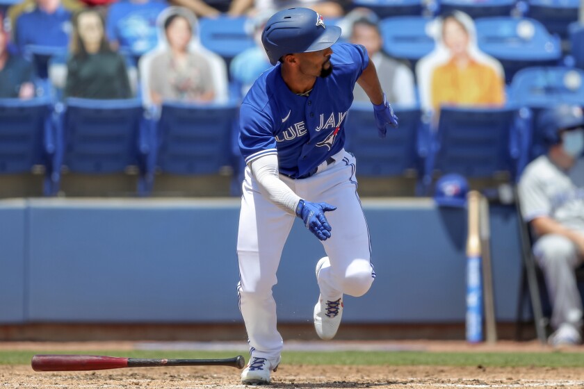 Toronto Blue Jays' Marcus Semien follows through on a two-run double against the Atlanta Braves during the third inning of a baseball game Sunday, May 2, 2021, in Dunedin, Fla. (AP Photo/Mike Carlson)