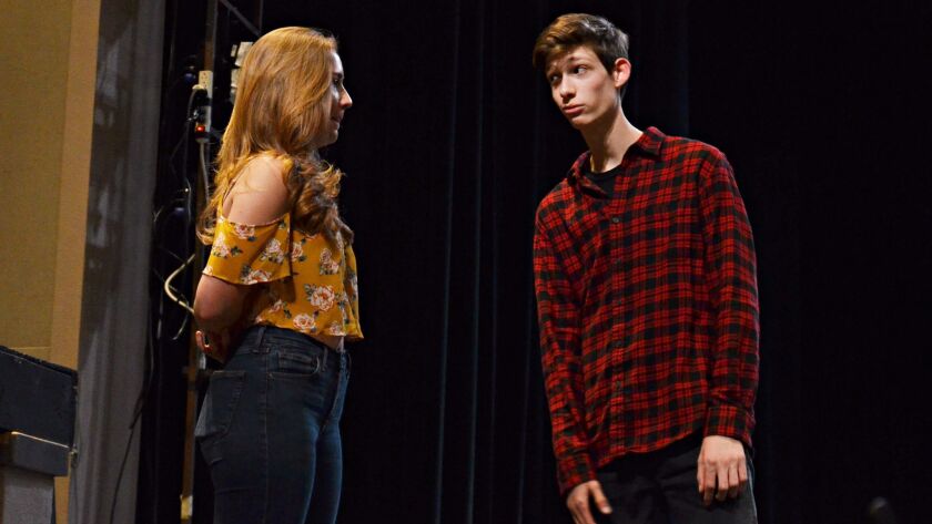 Avery-Claire Nugent and Jonas McMullen rehearse a scene from “Footloose,” which will be performed at Canyon Crest Academy later this month.