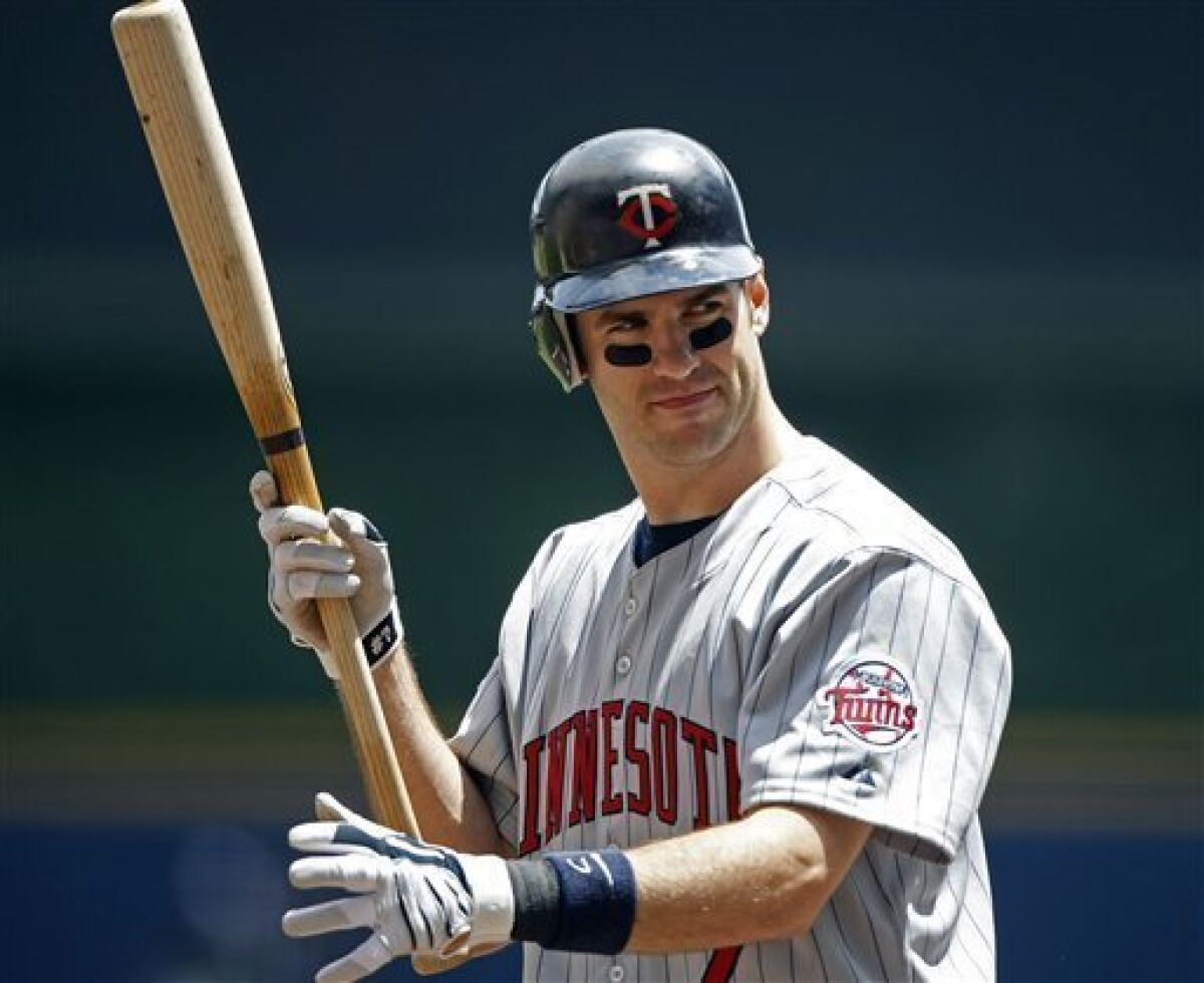 FILE - This is a June 25, 2009, file photo showing Minnesota Twins' Joe Mauer during a baseball game in Milwaukee. Mauer has become only the second catcher in 33 years to win the American League Most Valuable Player Award, Monday, Nov. 23, 2009.(AP Photo/Jim Prisching, File)