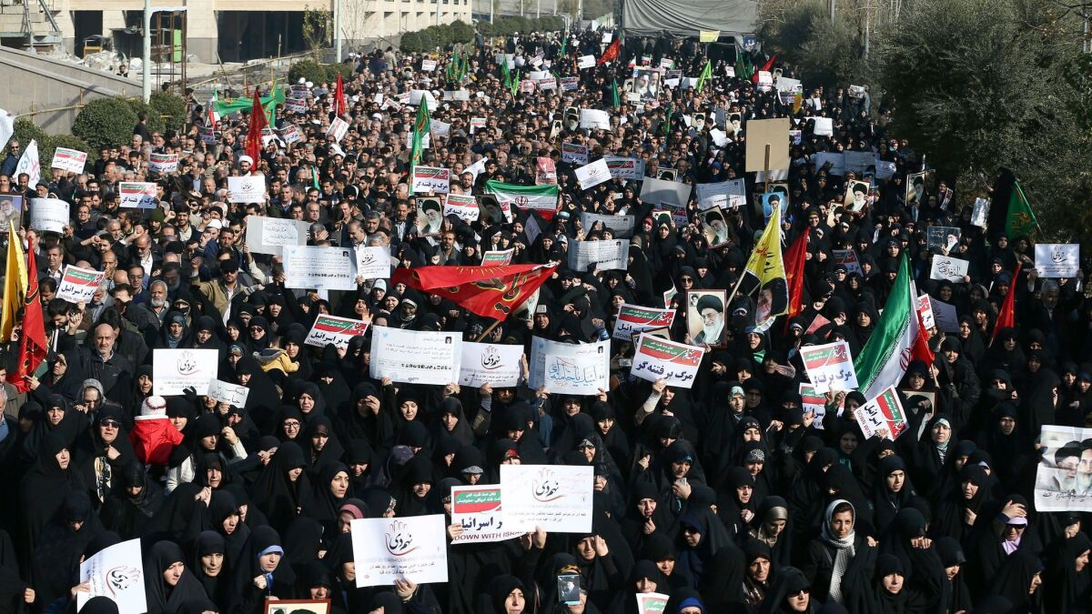 Iranian protesters chant slogans at a rally in Tehran, Iran on Dec. 30.