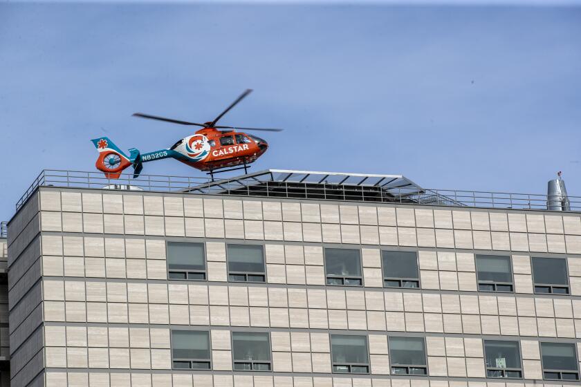 WESTWOOD, CA, SUNDAY, APRIL 26, 2020 A medevac helicopter lands atop Ronald Reagan UCLA Medical Center. (Robert Gauthier / Los Angeles Times)