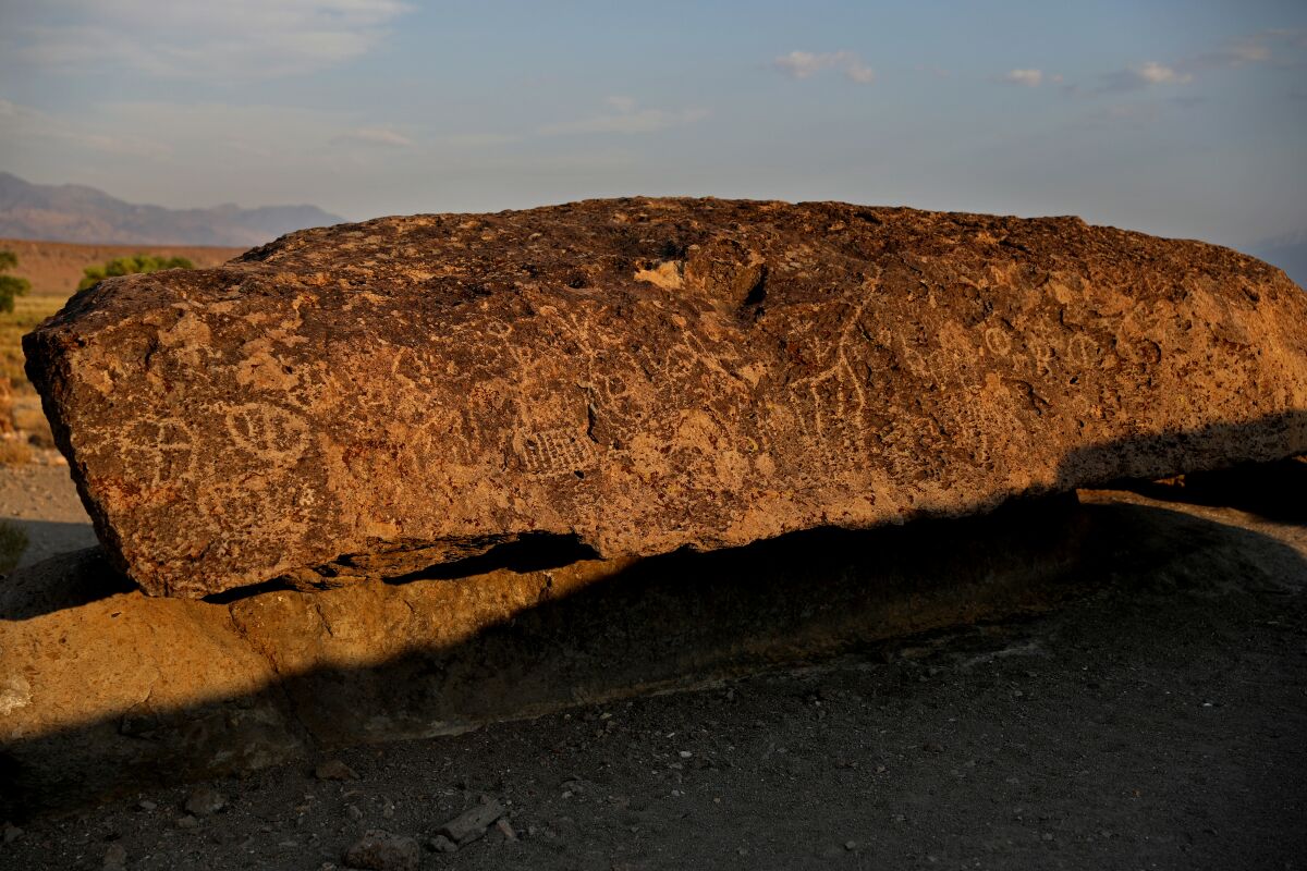 A Caltech professor drilled into rock to extract core samples at the Fish Slough Petroglyph site near Bishop, Calif. 