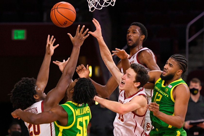 LOS ANGELES, CA - FEBRUARY 22: Ethan Anderson #20 of the USC Trojans. Eric Williams Jr. #50 of the Oregon Ducks.