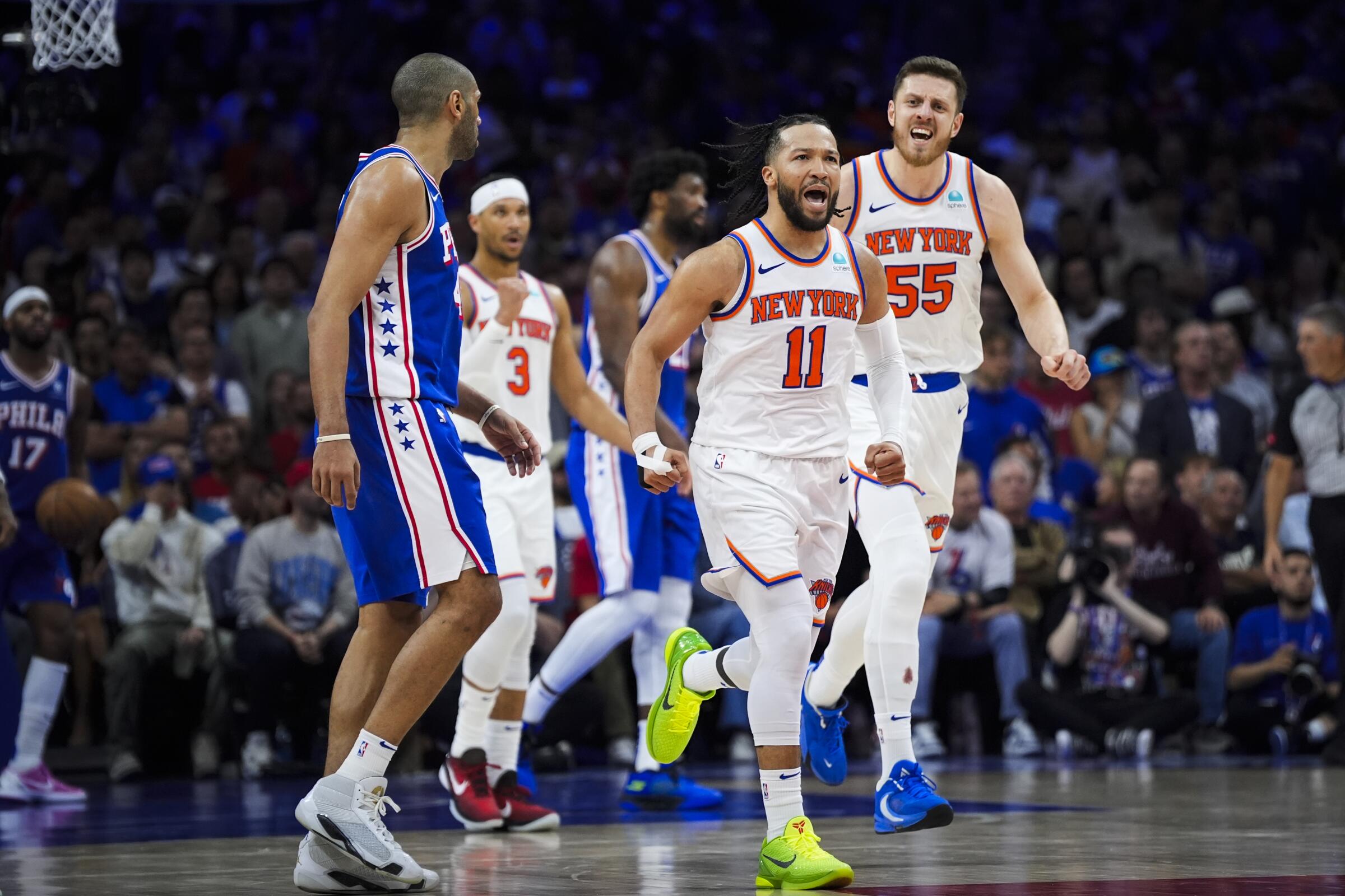 New York's Jalen Brunson (11) reacts during the Knicks' 118-115 victory over the Philadelphia 76ers.