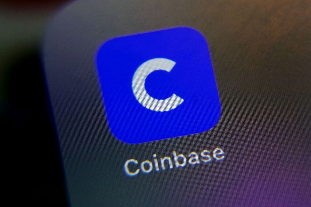 FILE - The mobile phone icon for the Coinbase app is shown in this photo, in New York, Tuesday, April 13, 2021. Cryptocurrency trading platform Coinbase has lost half its value in the past week, including its biggest one-day drop ever on Wednesday, May 11, 2022, as the famously volatile crypto market weathers yet another slump. (AP Photo/Richard Drew, File)