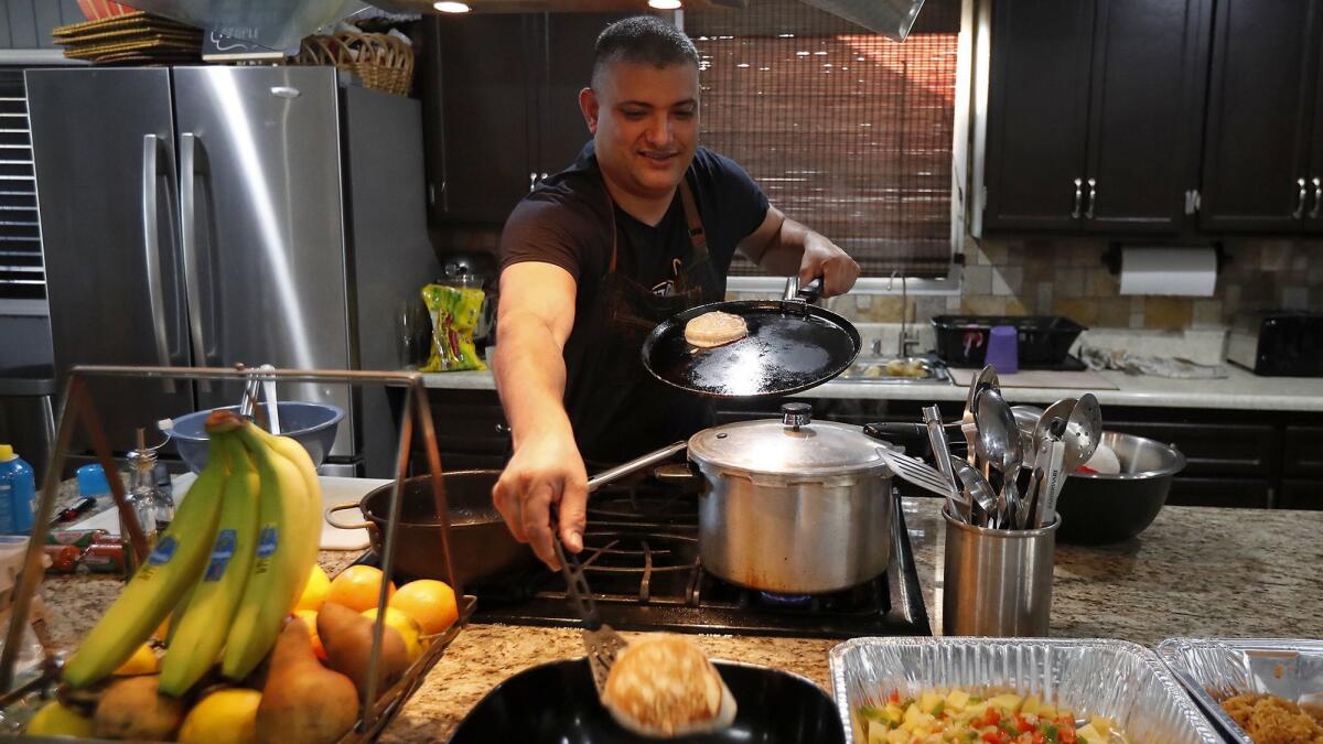 Steve Rivera makes the first of up to 300 pancakes he planned to prepare at his Garden Grove home to share with fellow TSA agents at John Wayne Airport.