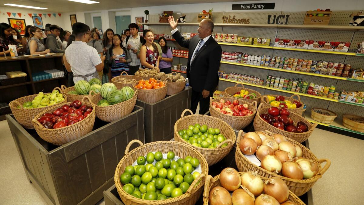 Thomas A. Parham welcomed students into UC Irvine's new food pantry last fall when he served as vice chancellor of student services. A campus review found he committed sex discrimination by paying three female staff members less than men for the same or similar work.