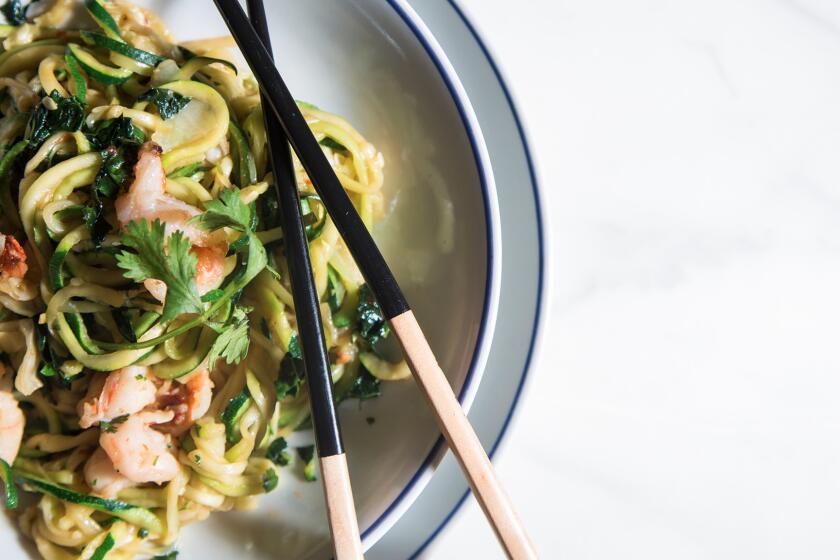 Stir-fried zucchini noodles with greens and shrimp.