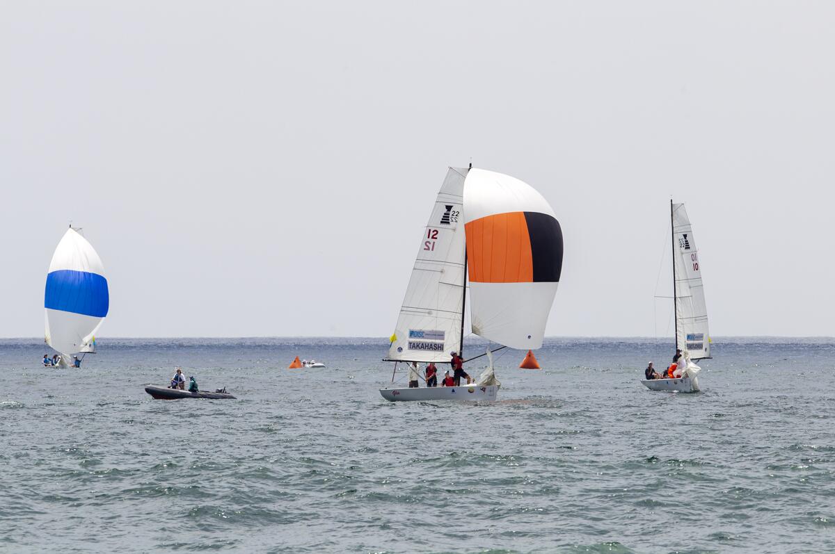 The boats skippered by Leonard Takahashi, center, and Nick Egnot-Johnson, right, compete in the 53rd Governor's Cup in Newport Beach on Tuesday.