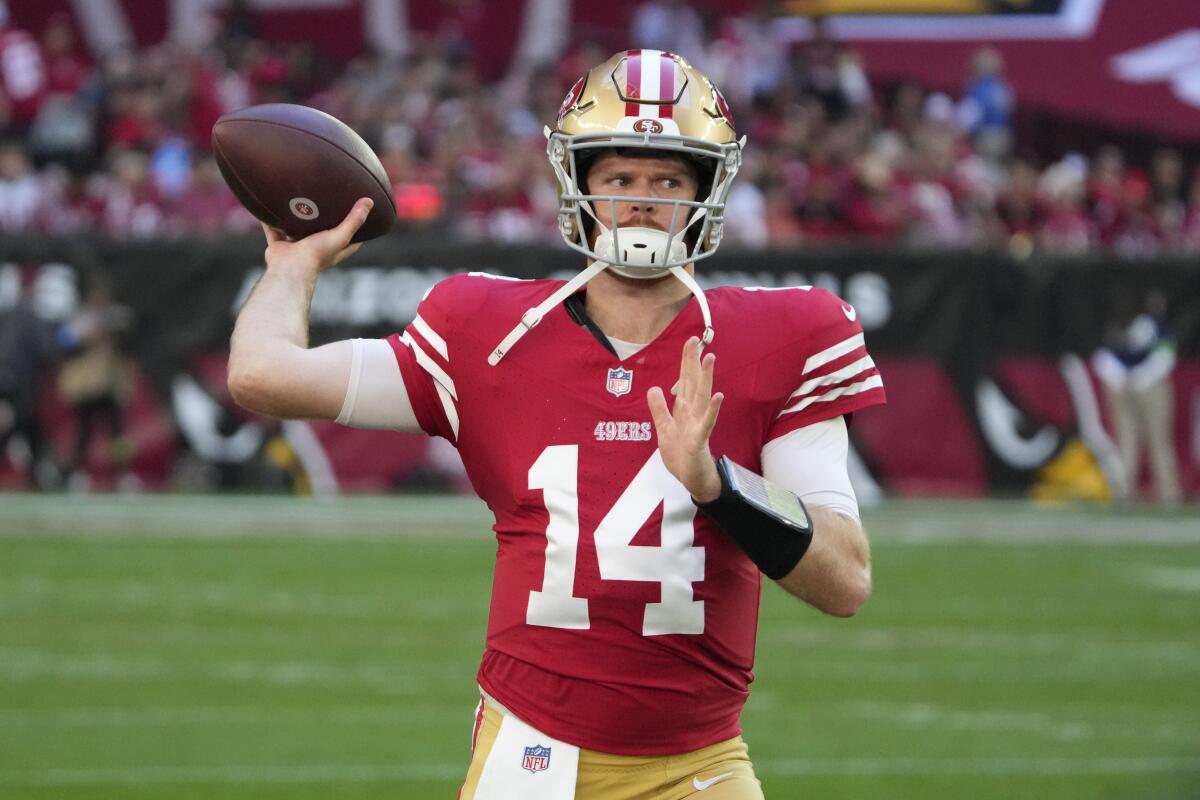 San Francisco 49ers quarterback Sam Darnold (14) warms up before agame against the Arizona Cardinals.