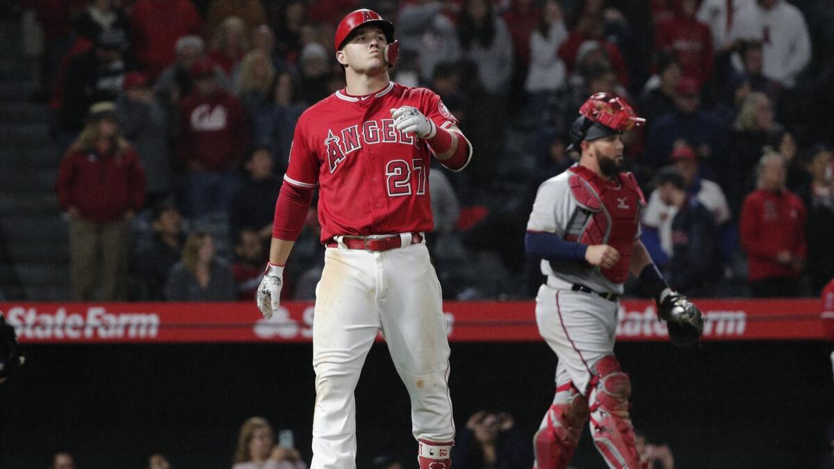 Mike Trout reacts as shortstop Gregorio Petit catches his 118.0-mph line drive to end Friday's game. Says Minnesota Twins catcher Bobby Wilson, right: It’s a distinctive sound that I only hear with certain guys, and those guys happen to be really, really good.”