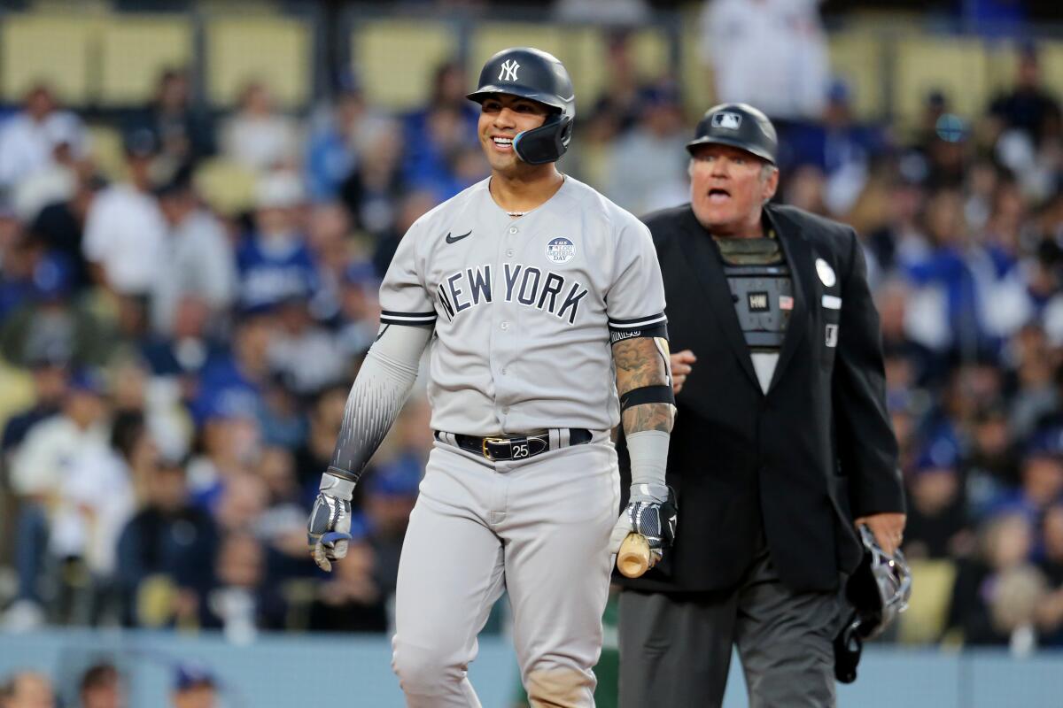 New York Yankees second baseman Gleyber Torres reacts next to home plate umpire Hunter Wendelstedt.