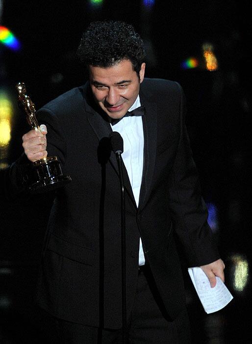 Composer Ludovic Bource accepts the original score Oscar for "The Artist."