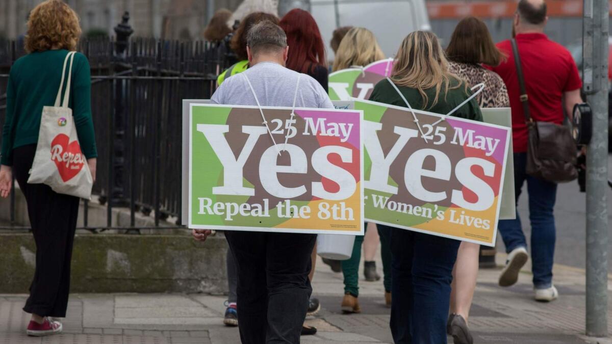 Activists urging people to vote "yes" on a repeal of the 8th Amendment of the Irish Constitution canvass voters in Dublin on May 24, 2018. Ireland will hold a referendum on May 25, 2018, on whether to alter its constitution to legalize abortion.