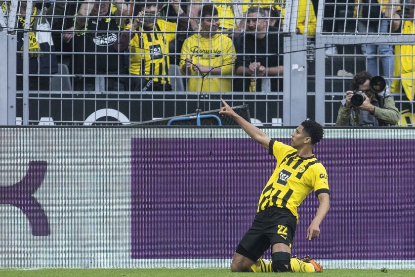 FILE - Dortmund's Jude Bellingham celebrates after scoring his side's second goal during the German Bundesliga soccer match between Borussia Dormund and Borussia Moenchengladbach in Dortmund, Germany, Saturday, May 13, 2023. Real Madrid and Borussia Dortmund have reached an agreement for the transfer of Jude Bellingham for a fee that could reach more than 130 million euros ($139 million), the German club said Wednesday, June 7, 2023.(Bernd Thissen/dpa via AP, File)