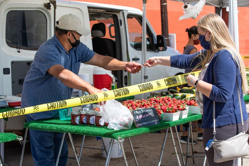 The Pacific Beach Tuesday Farmers' Market reopened for business May 19, with face coverings required for shoppers and vendors.