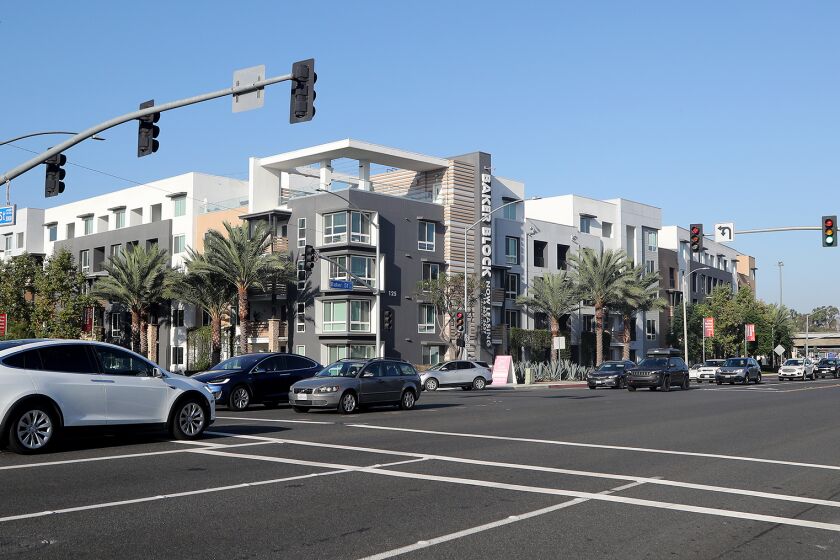 According to Costa Mesa resident Cynthia McDonald, Baker Block Apartments are an example of an unaesthetic, poorly located housing development that is boxy, not walkable or bikeable. ItOs the kind of thing she thinks could happen if Measure K is passed. (Kevin Chang / Daily Pilot)