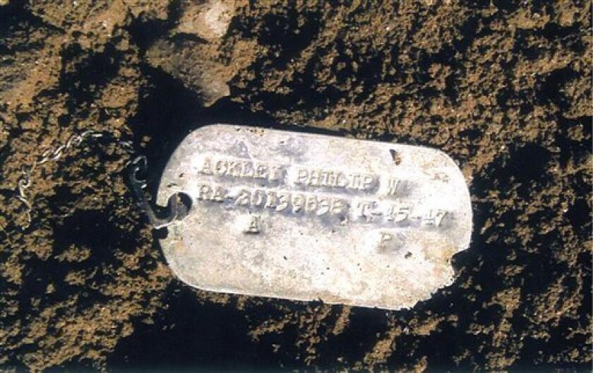 This undated photo provided Wednesday, July 14, 2010 by the U.S. Defense Dept. shows Pfc. Philip W. Ackley's Korean War dog tag. The tag, which was found in North Korea's Unsan battlefield area where Ackley is believed to have been lost, was handed over to the U.S. by North Korean at the Panmunjom truce village in January, 2010. Since 2005, the U.S. government has refused to work with North Korea to recover the men of Unsan and others among more than 8,000 U.S. missing in action from the 1950-53 war. (AP Photo/U.S. Defense Dept.)