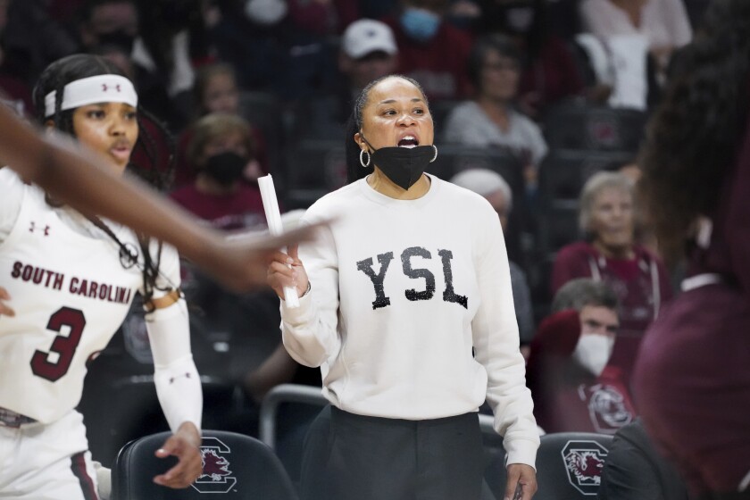 South Carolina head coach Dawn Staley communicates with players during the second half of an NCAA college basketball game against Mississippi State Sunday, Jan. 2, 2022, in Columbia, S.C. South Carolina won 80-68. (AP Photo/Sean Rayford)